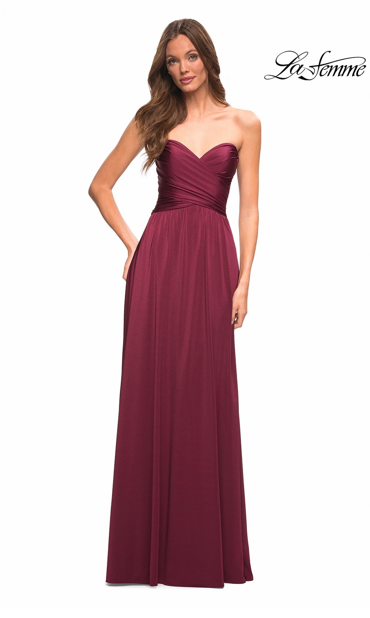 A woman wears the Long Prom Dress: La Femme 30700, a strapless jersey gown with a sweetheart neckline and A-line silhouette, against a white background. The La Femme logo appears top right.